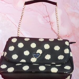 Betsy Johnson white and black print shoulder bag with gold tone chain.